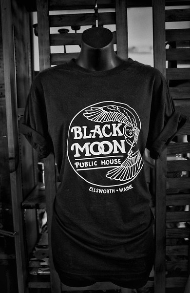 A black Black Moon t-shirt on a display form